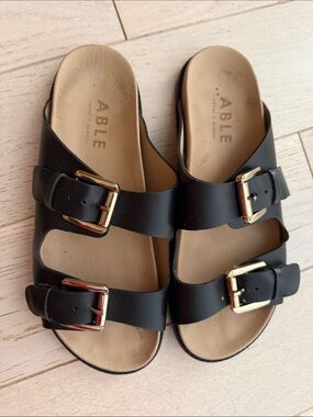ABLE Black Leather Double-Buckle Slide Sandals with Gold Buckles